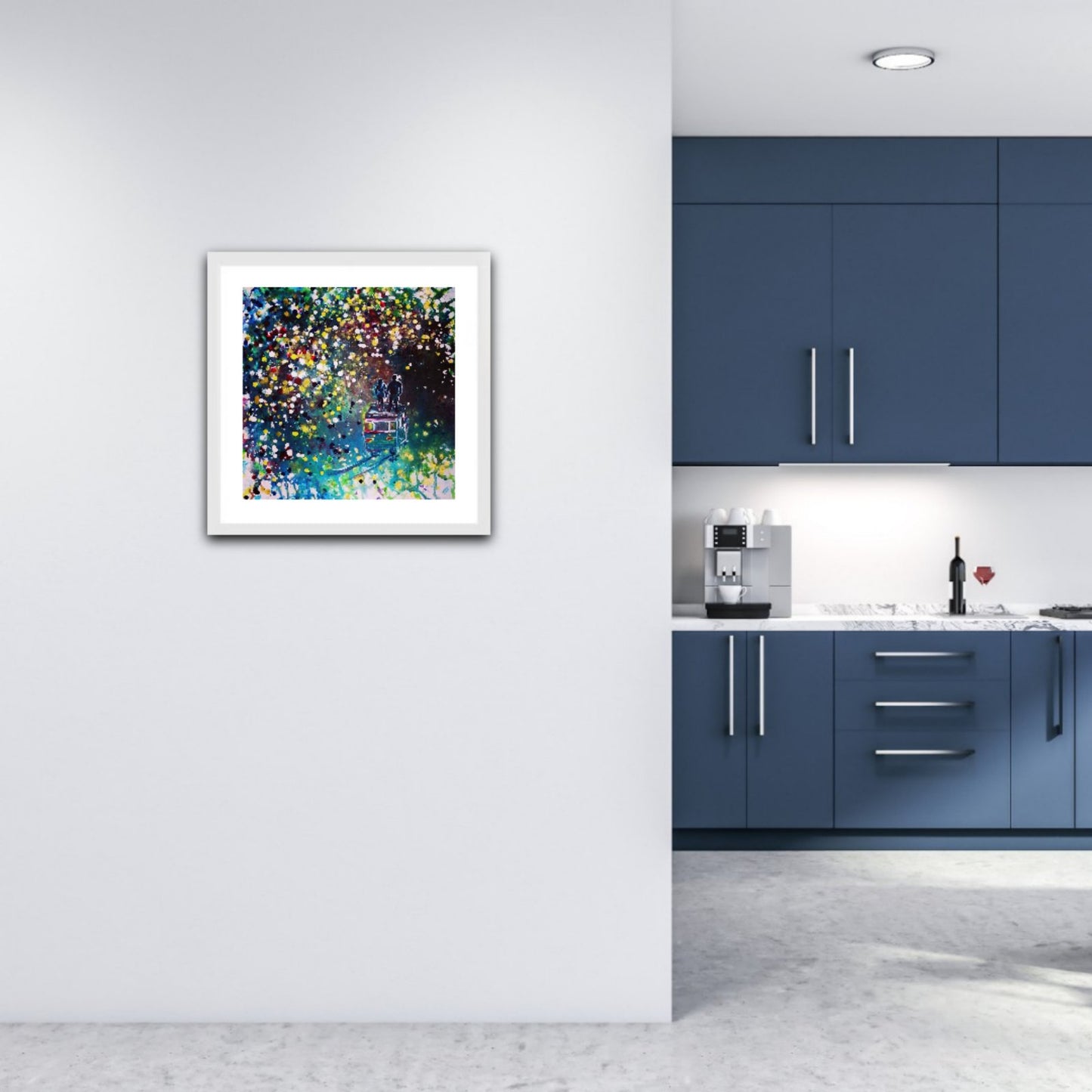 Original Painting, Pointillism, TRAXI, Spiritual Abstract, Vintage Bus, Starry Night, Romance, Contemporary Art, Wall Decor, Triptych, Collectible Art A framed abstract art print with vibrant multicolored paint splatters hangs on a white wall in a modern kitchen setting with blue cabinets.