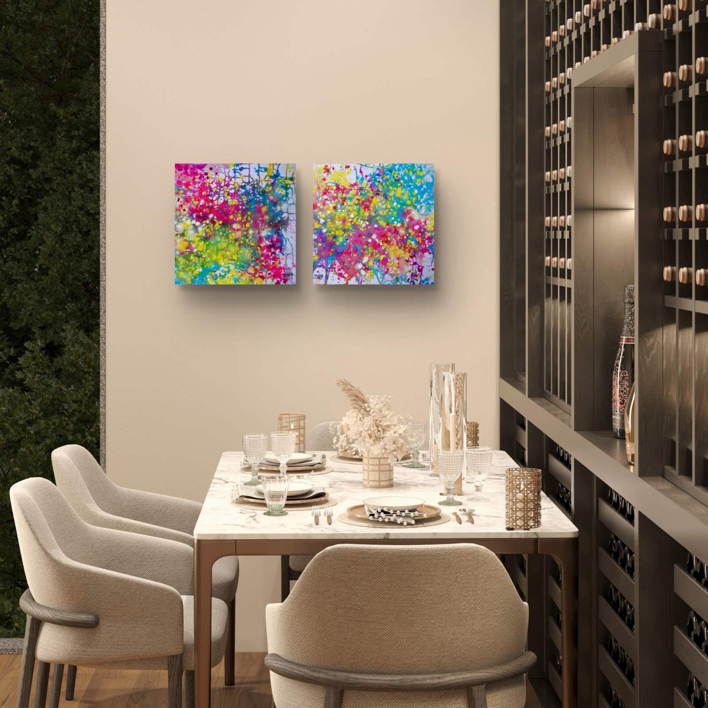Paintings of Happiness Dyptich by Diana Dimova TRAXI,  Colorful Abstract Art Set. Two square abstract canvas prints with vibrant multicolor paint splatters hang on a beige wall above a modern dining table set with chairs in a stylish dining room.