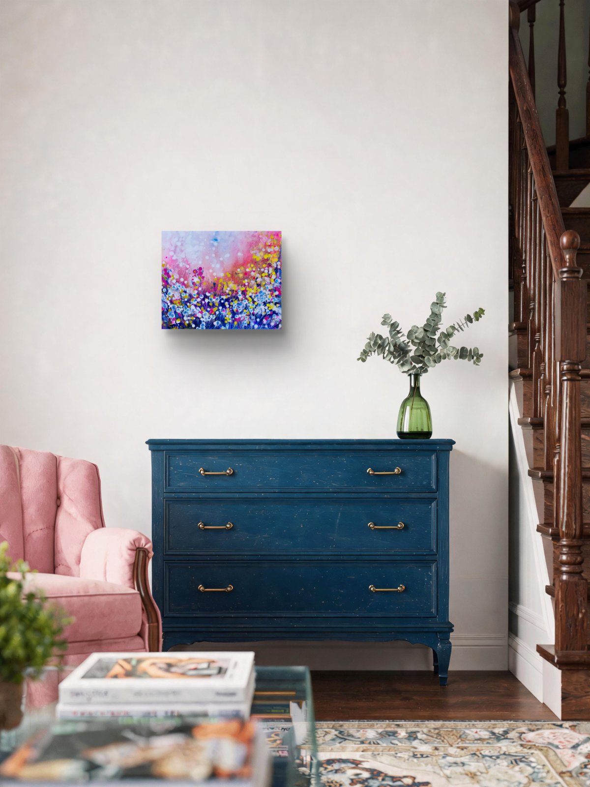Original Painting, Life is Wonderful, Abstract Landscape, Dandelions Art, Pink and Blue Abstract, Small Art Gift, Diana Dimova TRAXI, Romantic Painting, Contemporary Fine Art, 30x25 cm A colorful abstract canvas print with pink, blue, and yellow tones, displayed on a white wall above a dark blue three-drawer dresser in a styled living room setting.