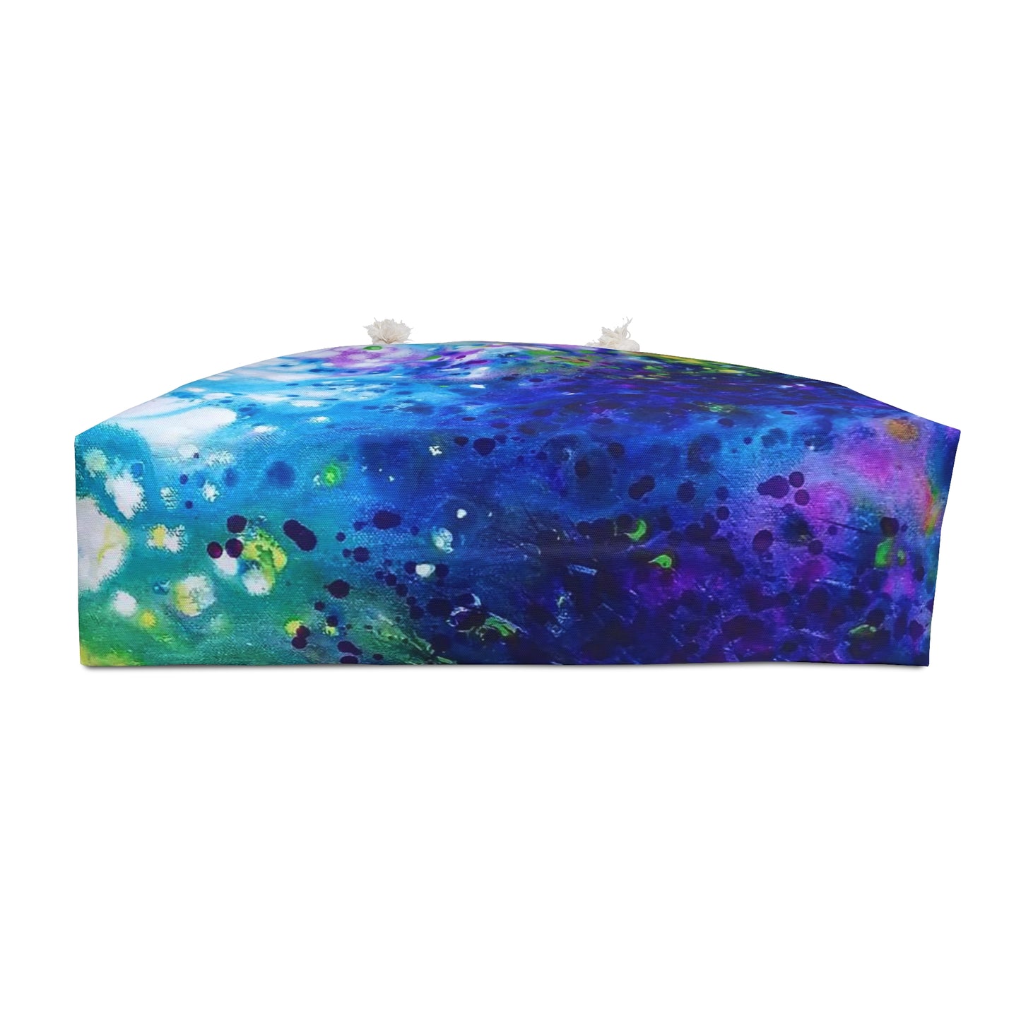 Aromatic lavender symphony beach bag featuring vibrant wearable art inspired by the painting Aromatic Lavender Symphony by Diana Dimova TRAXI. A rectangular floor cushion with a vibrant abstract watercolor print in shades of blue, purple, green, and white, featuring two small white decorative flowers on top, set against a plain white background.
