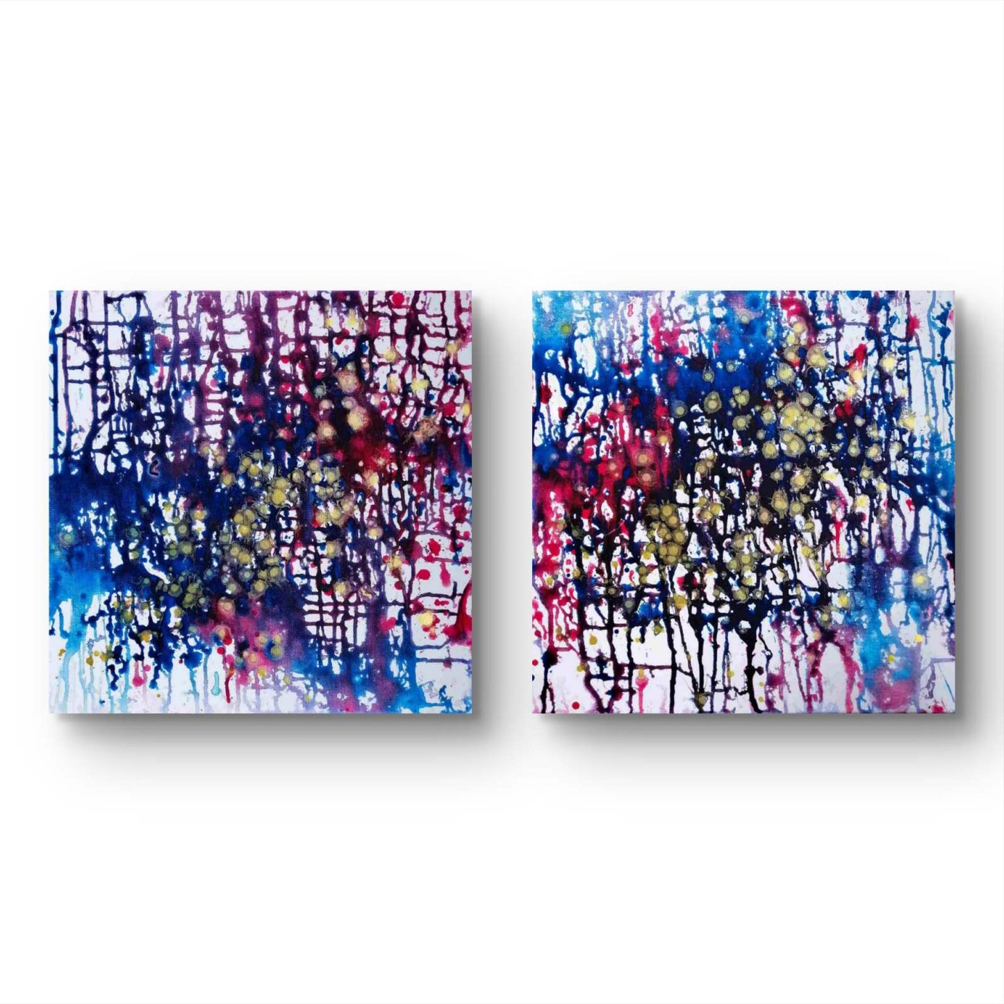 Award-winning abstract diptych Greed and Fear by Diana Dimova TRAXI, fluid acrylic pouring in white, blue, rose and gold tones Two square abstract wall art panels with colorful paint splatters and drips on a white background, shown side by side.