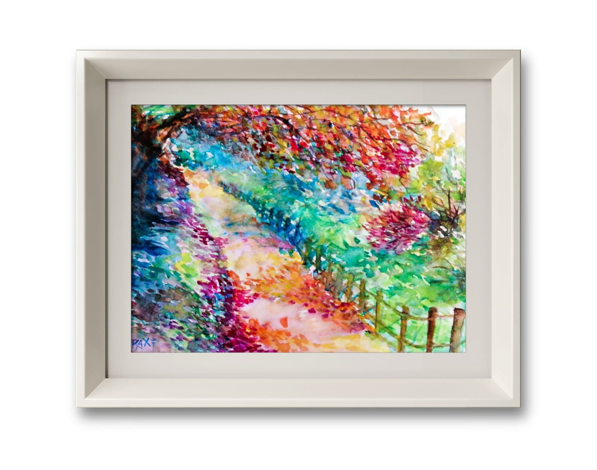 Colorful Autumn Landscape, original fall watercolor painting with an autumn path on paper by contemporary artist TRAXI. A framed watercolor painting of a colorful path winding through a lush, vibrant forest, presented in a white frame against a clean white background.