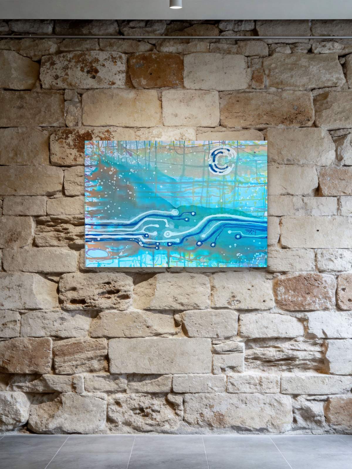 Seascape & Technology "Ocean Dialogue," an original contemporary abstract Blue  Ocean painting by Diana Dimova – TRAXI.  An abstract blue and turquoise canvas painting with white circuit-like lines and a circular motif, displayed on a rustic stone wall.