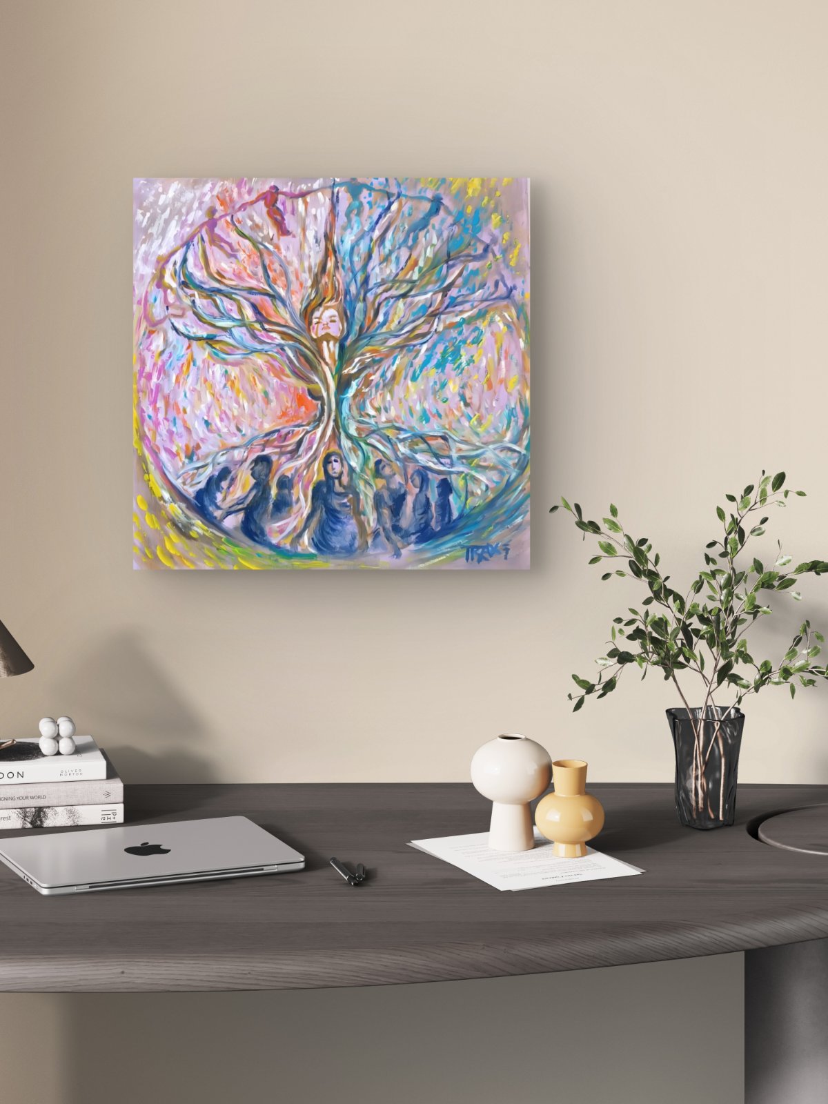 Original abstract painting Connected to the Internet by Diana Dimova TRAXI, featuring organic lines and neural network flows in rich blue and red tones. A colorful abstract canvas art print depicting a tree with figures, displayed on a beige wall above a modern gray desk with a laptop, small vases, and a plant.