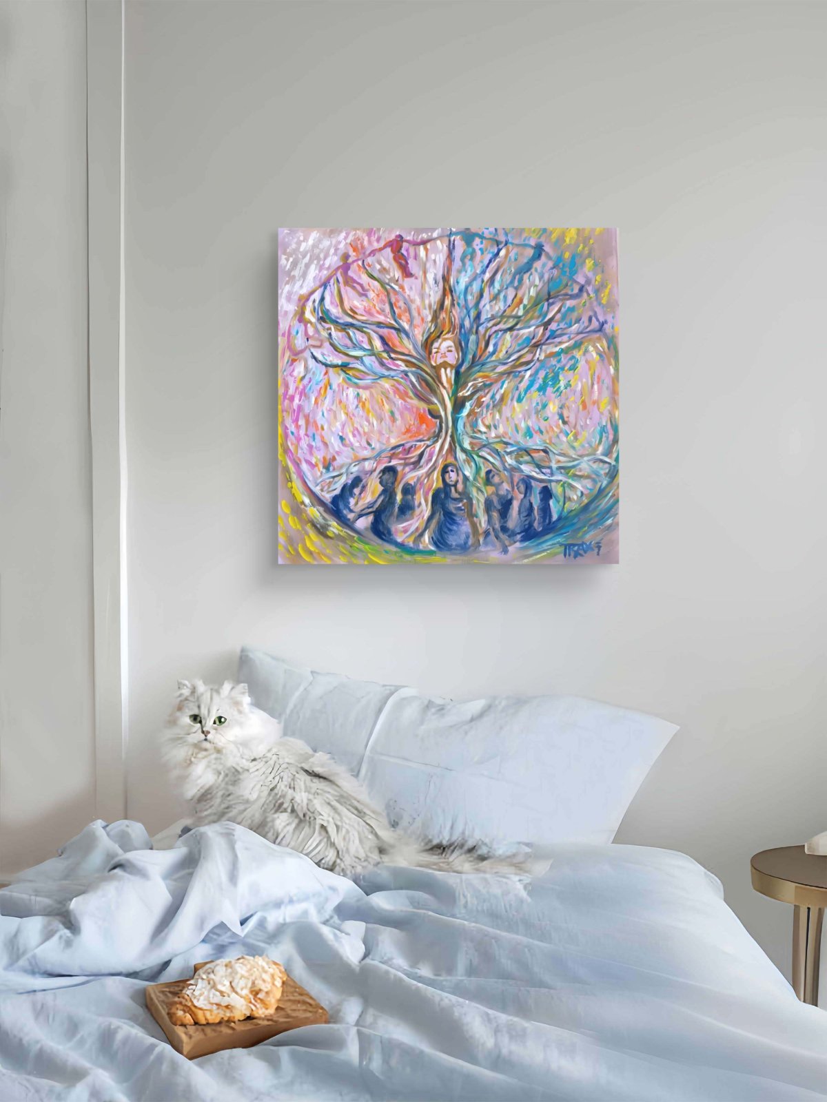 Original abstract painting Connected to the Internet by Diana Dimova TRAXI, featuring organic lines and neural network flows in rich blue and red tones. A colorful abstract canvas print of a tree of life hangs on a light gray wall above a bed with white bedding and a fluffy white cat resting on the bed. A small wooden tray with pastries sits in the foreground.