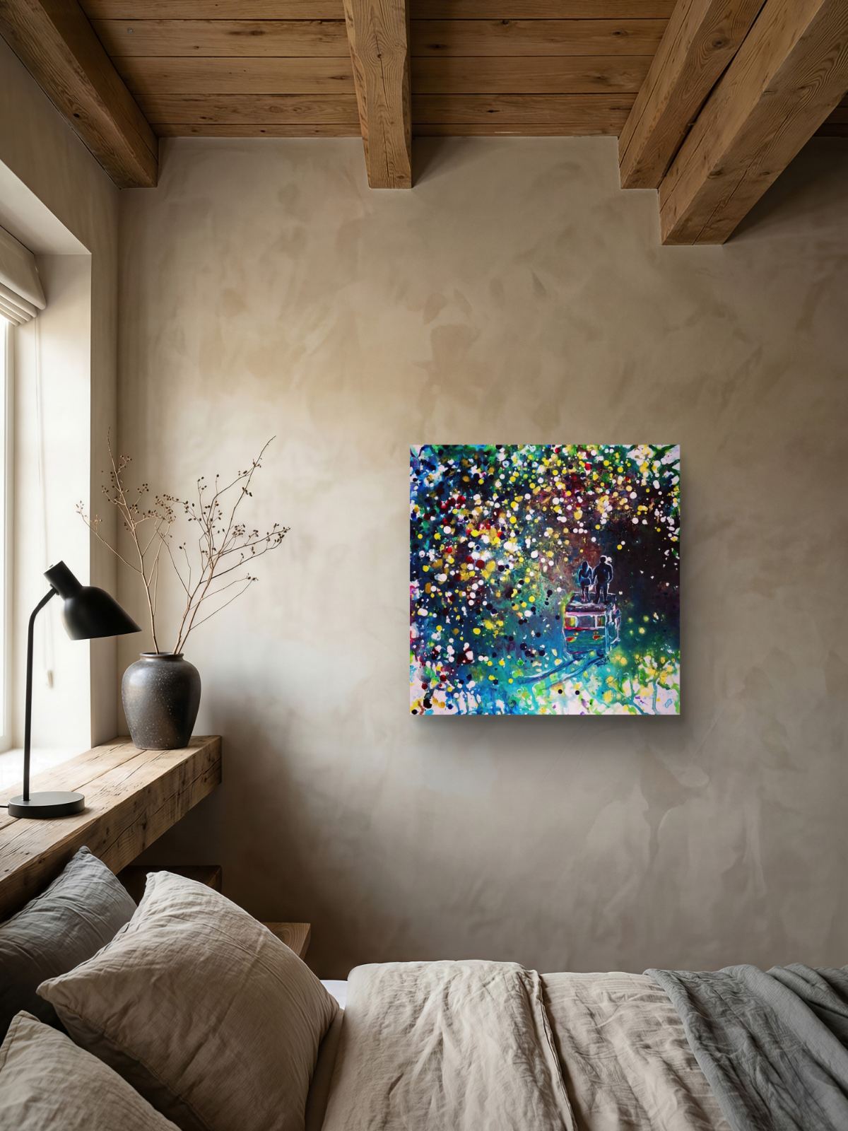 Original Painting, Pointillism, TRAXI, Spiritual Abstract, Vintage Bus, Starry Night, Romance, Contemporary Art, Wall Decor, Triptych, Collectible Art A square abstract canvas print with vibrant multicolored paint splatters hangs on a textured beige plaster wall in a rustic bedroom setting with wooden ceiling beams, a bed, and a bedside lamp.