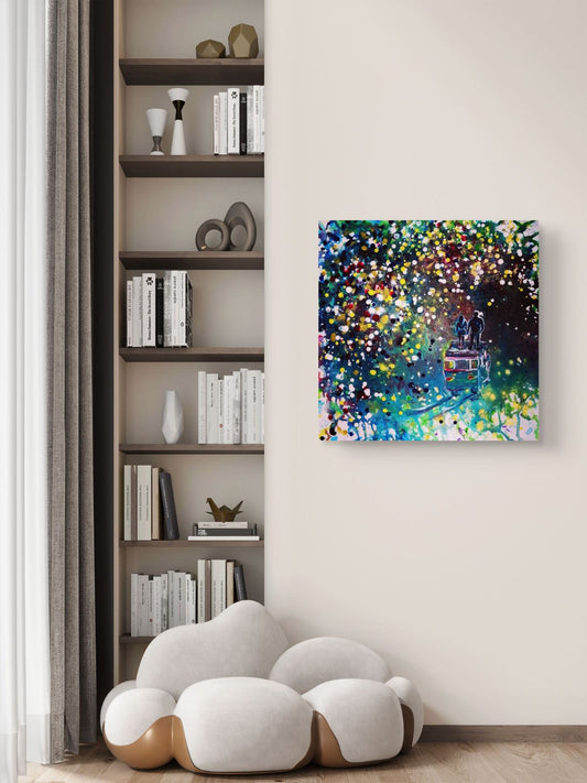 Original Painting, Pointillism, TRAXI, Spiritual Abstract, Vintage Bus, Starry Night, Romance, Contemporary Art, Wall Decor, Triptych, Collectible Art A colorful abstract canvas print depicting a vibrant, sparkling scene with blue, green, yellow, and white lights, displayed on a beige wall in a modern living room setting next to a built-in bookshelf and a cloud-shaped white sofa.