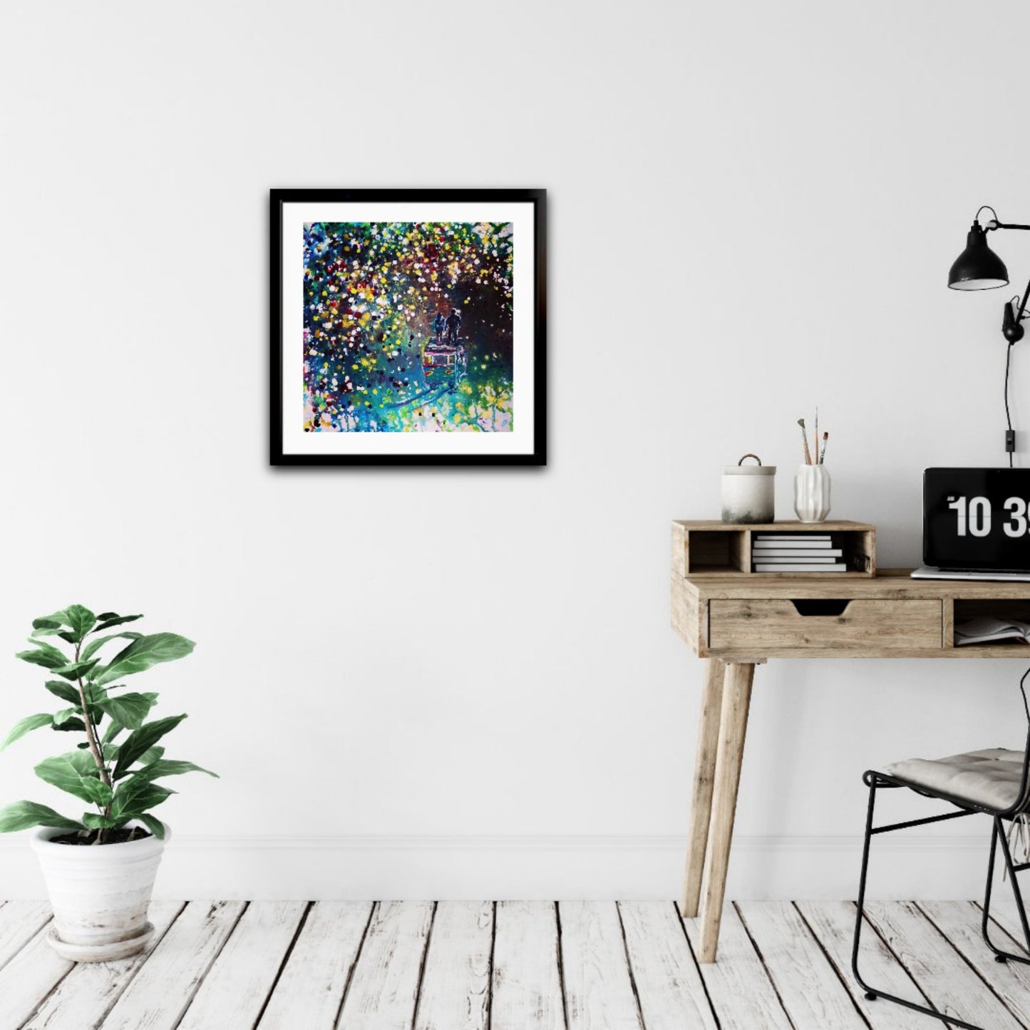 Original Painting, Pointillism, TRAXI, Spiritual Abstract, Vintage Bus, Starry Night, Romance, Contemporary Art, Wall Decor, Triptych, Collectible Art A framed abstract art print with a colorful splatter pattern hangs on a white wall in a modern room setting with a wooden desk, lamp, and potted plant.