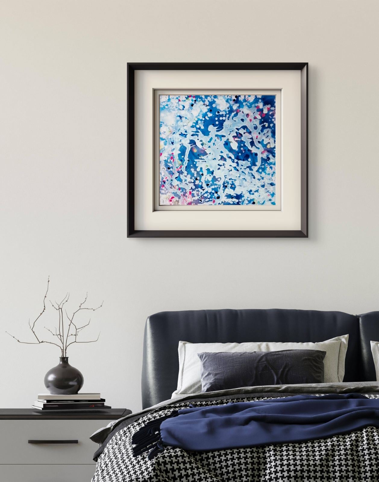 Original spiritual abstract painting Prayer by Diana Dimova TRAXI, featuring a white angel and protective wings in white and blue tones. Framed abstract wall art with swirling blue, white, and pink brushstrokes, displayed above a bed in a modern bedroom setting.
