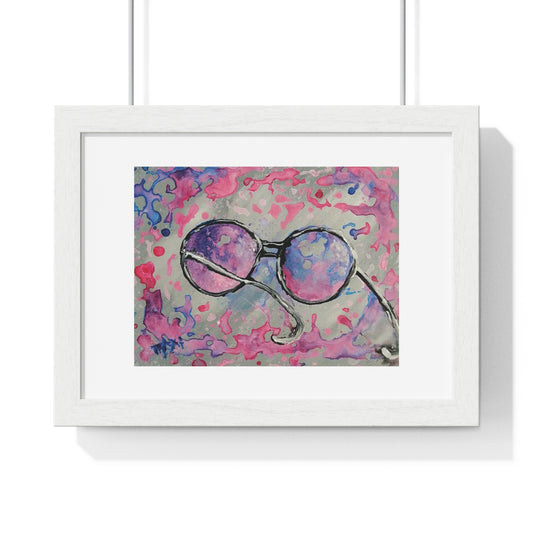 Pink glasses framed art print by contemporary artist TRAXI, featuring a joyful and optimistic theme on museum-quality archival matte paper. A framed art print featuring an abstract painting of round sunglasses with pink, purple, and blue watercolor details on a gray background, housed in a white frame with a white mat.