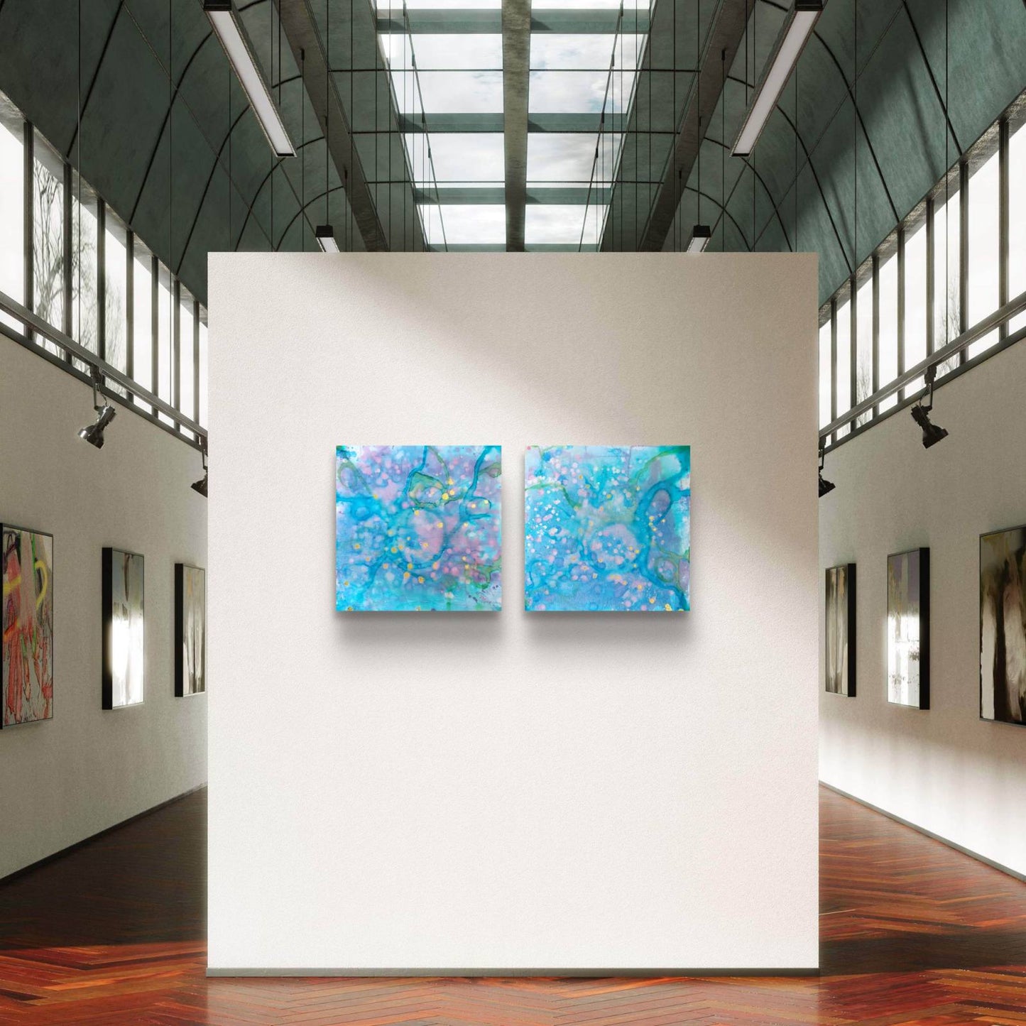 Original abstract diptych painting titled 'Rearrangement' by TRAXI, featuring textured layers in dialogue. The artwork explores themes of renewal, transition, and reconstruction through contemporary abstract expressionism. Two square abstract paintings with swirling blue, purple, and turquoise patterns hang side by side on a white gallery wall inside a modern art museum with high ceilings and wood floors.