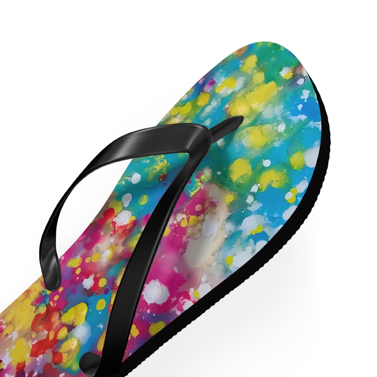 Summer beach flip flops of happiness featuring abstract wearable art inspired by the Paintings of Happiness series by Diana Dimova TRAXI. A single flip-flop sandal shown at an angle on a white background, featuring a vibrant multicolor watercolor paint splatter design on the footbed with black straps.
