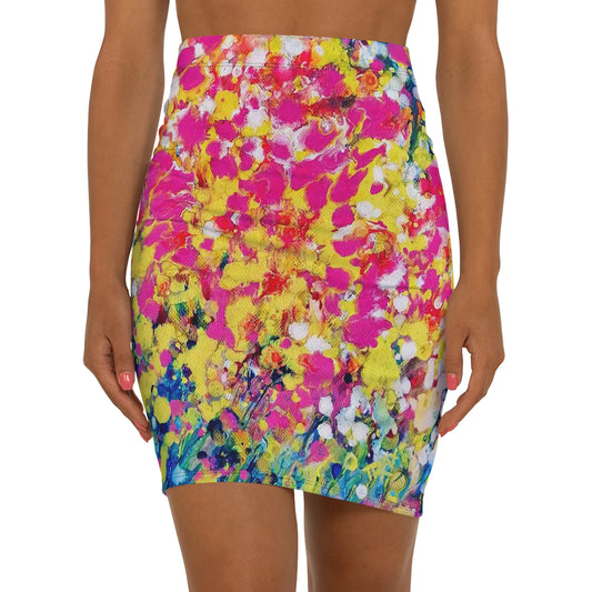 Women's summer mid-waist pencil skirt of happiness featuring abstract wearable art inspired by the painting Summer Flowers by Diana Dimova TRAXI. A model wearing a vibrant, multicolored abstract floral print mini skirt against a plain white background.