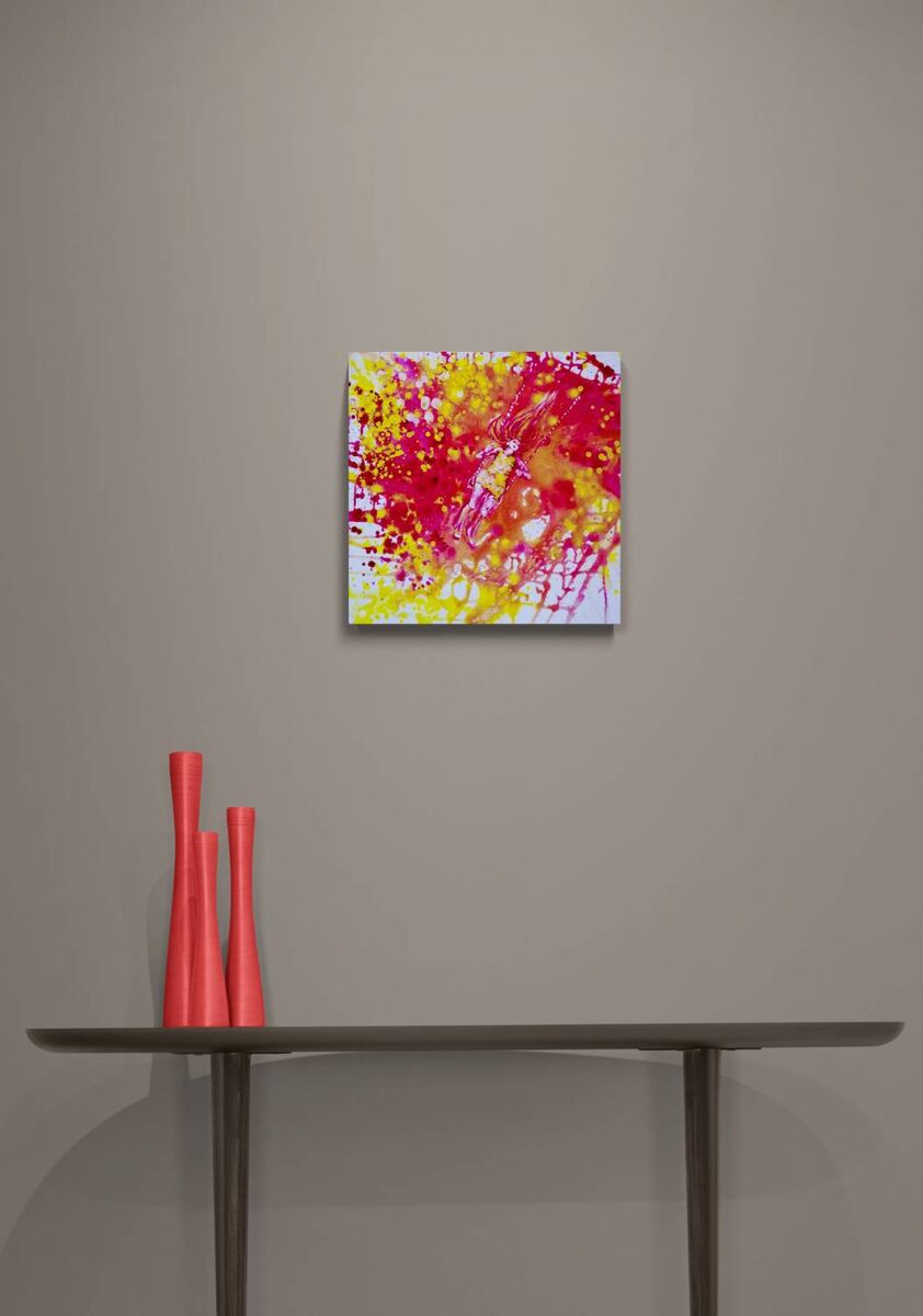 Sunshine Swing original fluid acrylic abstract painting by Diana Dimova TRAXI ART. Finalist Award winner 2022. Abstract wall art featuring vibrant splashes of red, yellow, and pink on a white background, displayed on a neutral gray wall above a console table with coral vases.