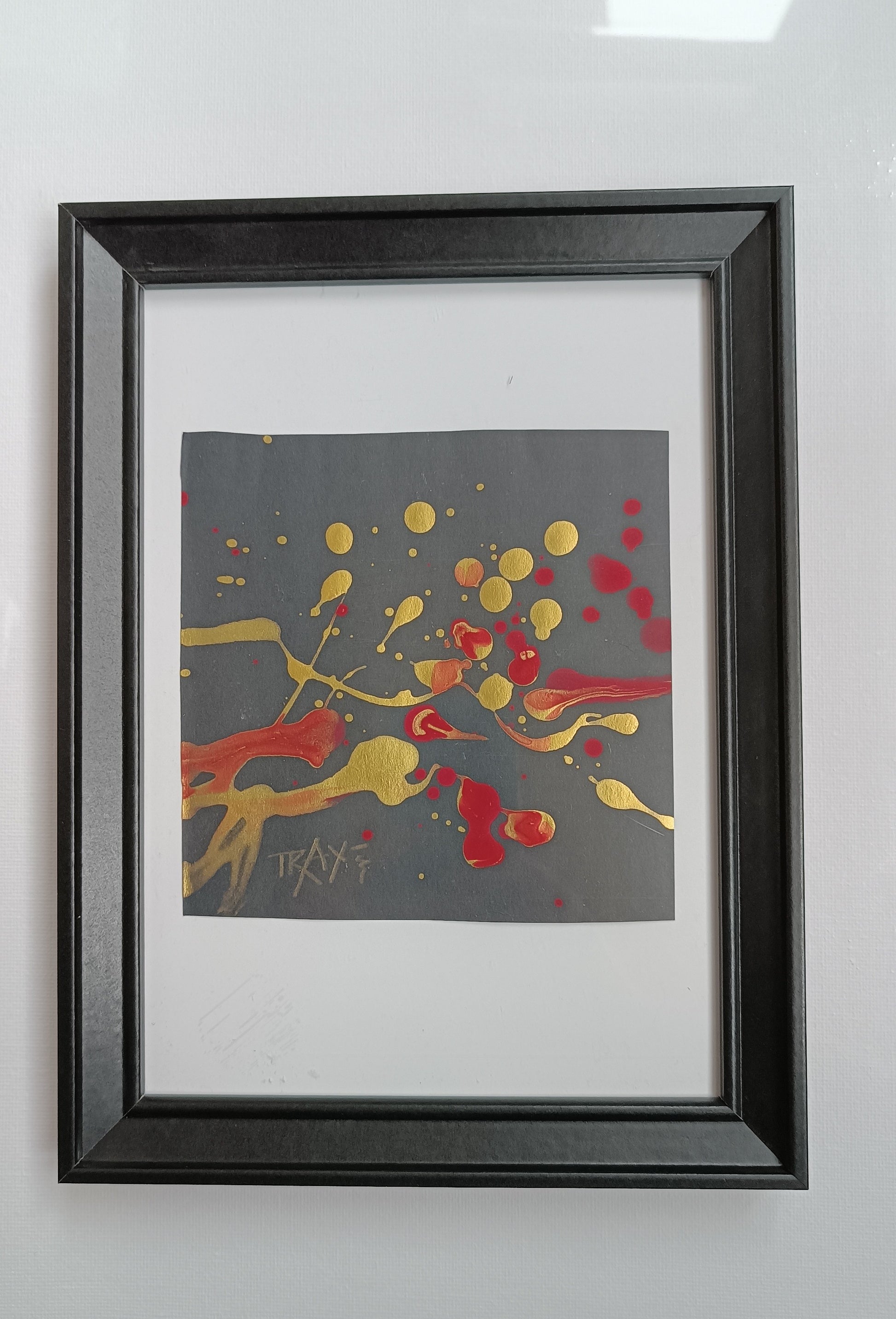 Talisman II framed authentic abstract small canvas artwork by Diana Dimova TRAXI, showcasing textured golden cells and red dynamic flows representing energy and balance.