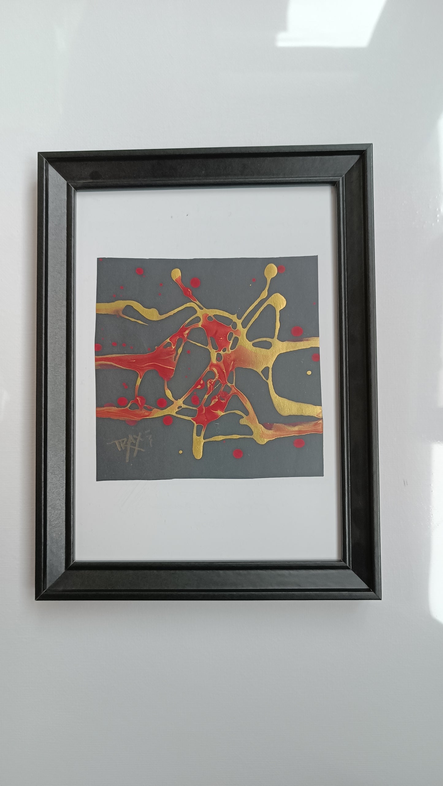 Talisman III framed minimal luxury abstract painting for wellness and spa interior design, original black, gold, and red sacred geometry artwork by TRAXI ART.