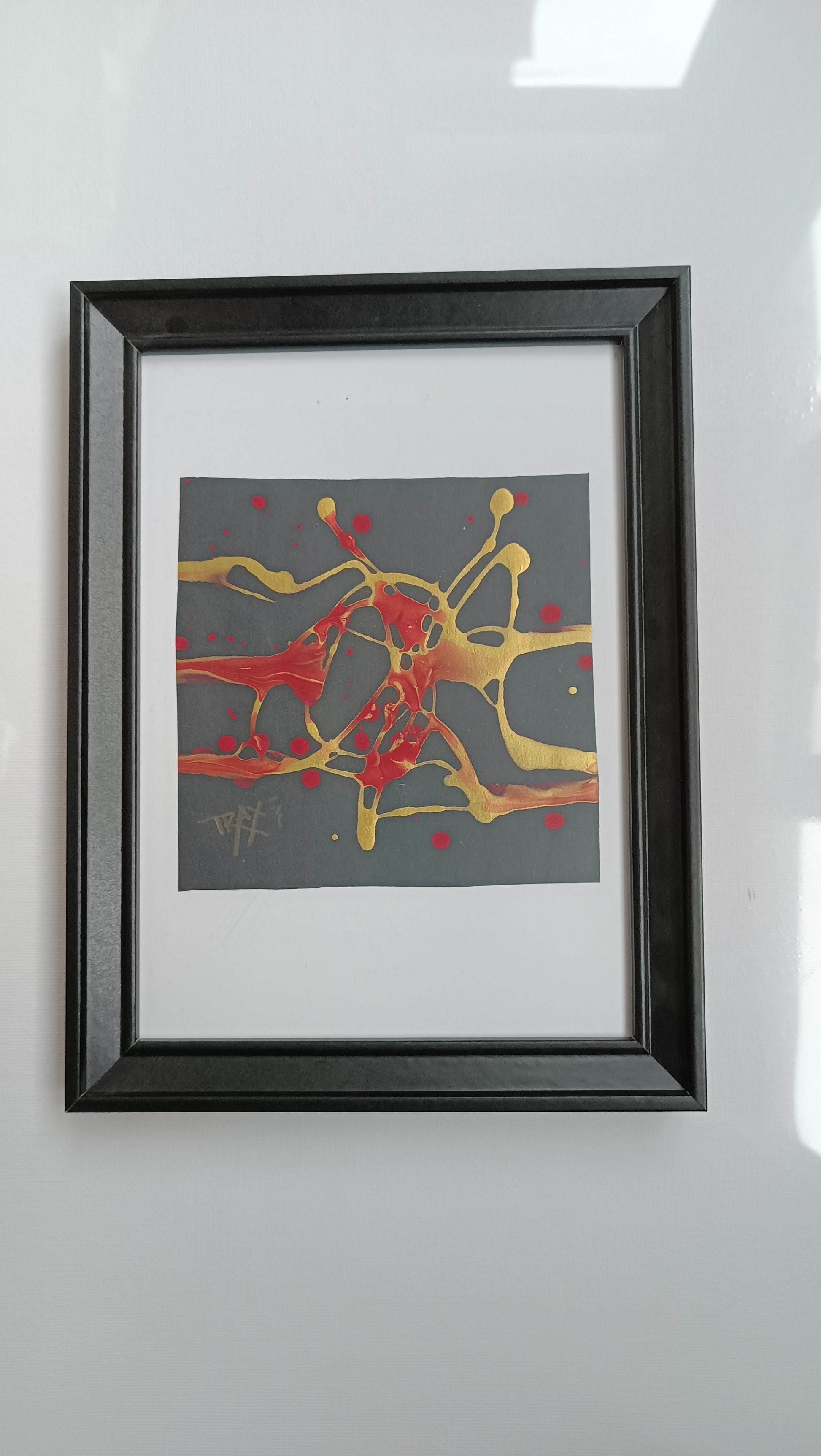 Talisman III framed minimal luxury abstract painting for wellness and spa interior design, original black, gold, and red sacred geometry artwork by TRAXI ART.