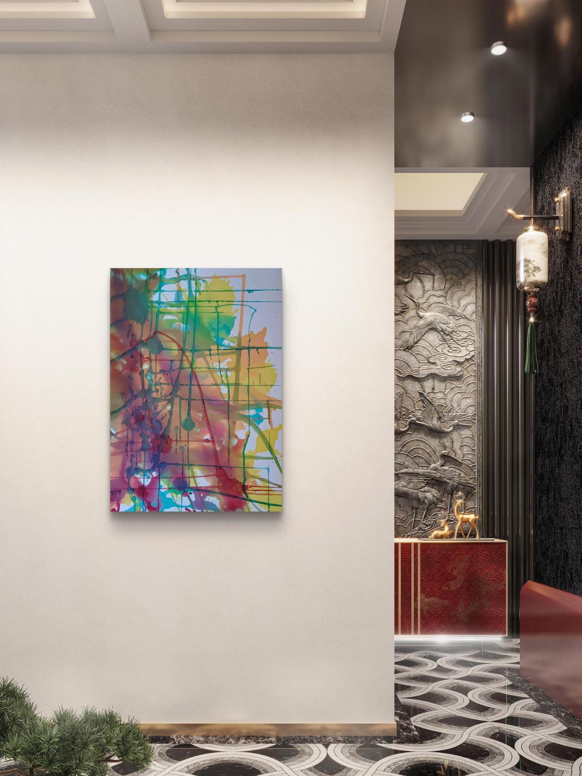 Original abstract painting titled 'The Fracture' by TRAXI, featuring expressive textures and dynamic movement. The artwork explores themes of change and emotional transformation through contemporary abstract expressionism. A colorful abstract canvas wall art print featuring vibrant splashes of green, blue, purple, yellow, and red with thin black lines, displayed on a light beige wall in a modern interior hallway.