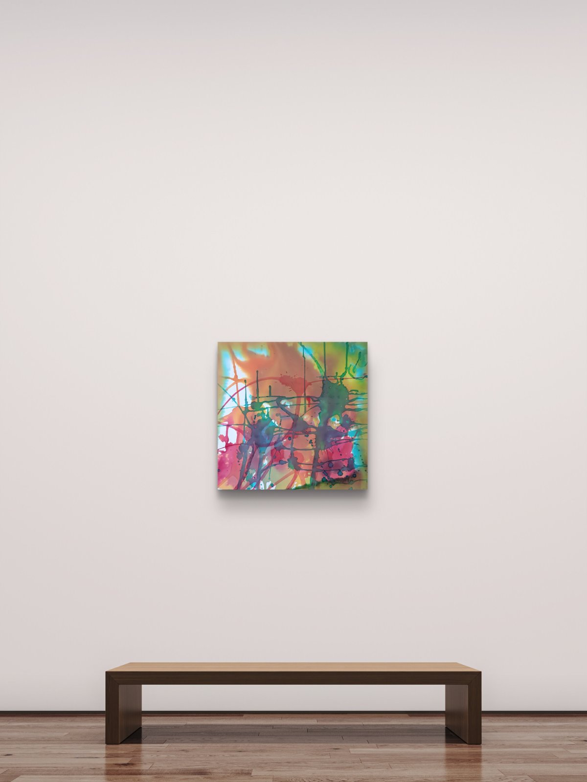 Original abstract painting titled 'The Noise' by TRAXI, featuring fragmented forms and energetic movement. The artwork explores urban life and contemporary chaos through abstract expressionism. An abstract square canvas painting with vibrant splashes of pink, green, orange, and blue, displayed on a minimalist beige wall above a low wooden bench.