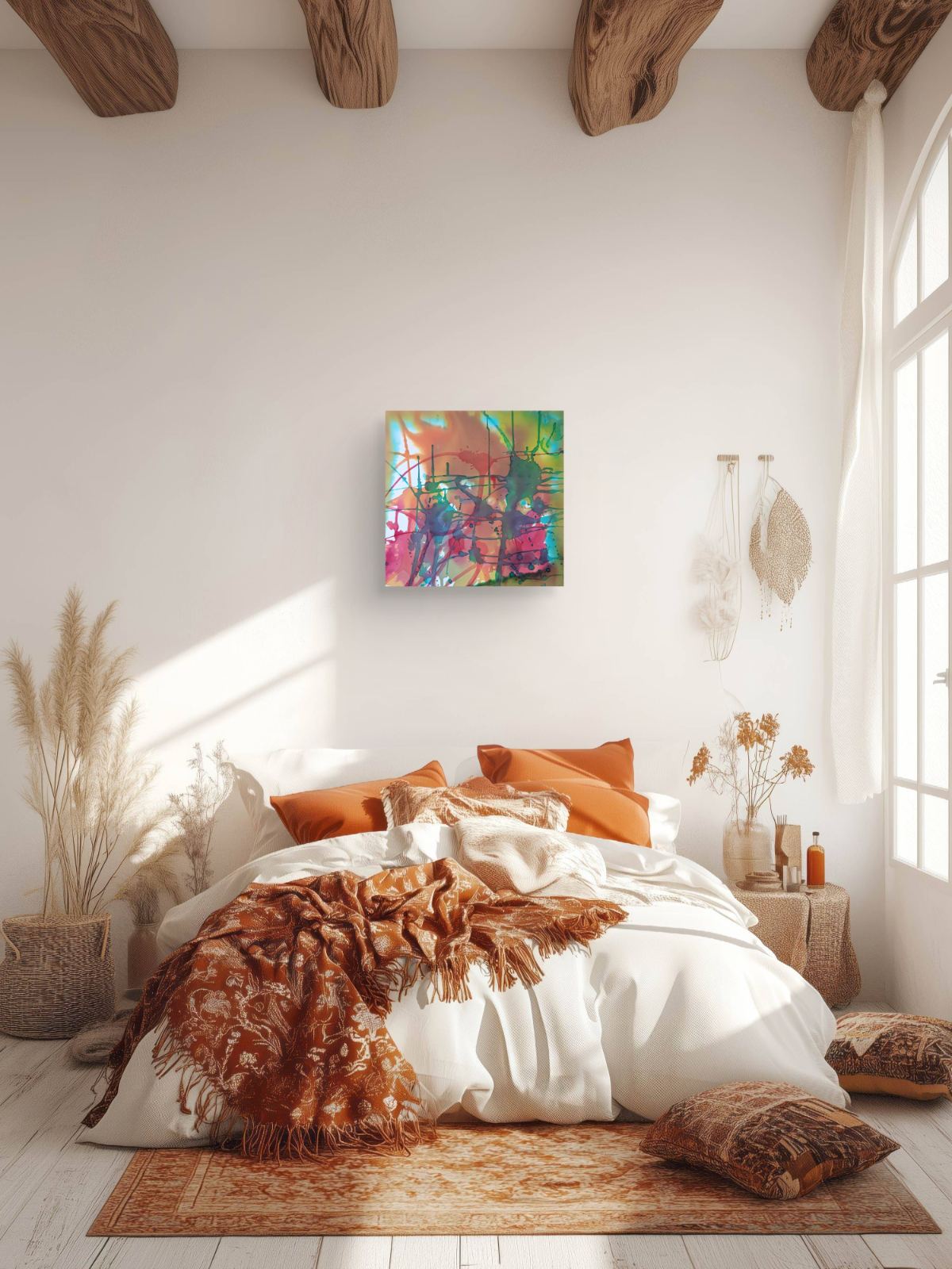 Original abstract painting titled 'The Noise' by TRAXI, featuring fragmented forms and energetic movement. The artwork explores urban life and contemporary chaos through abstract expressionism. A colorful abstract canvas print with vibrant green, pink, orange, and blue brushstrokes, displayed on a white wall above a bed with white linens and orange pillows in a rustic, sunlit bedroom.