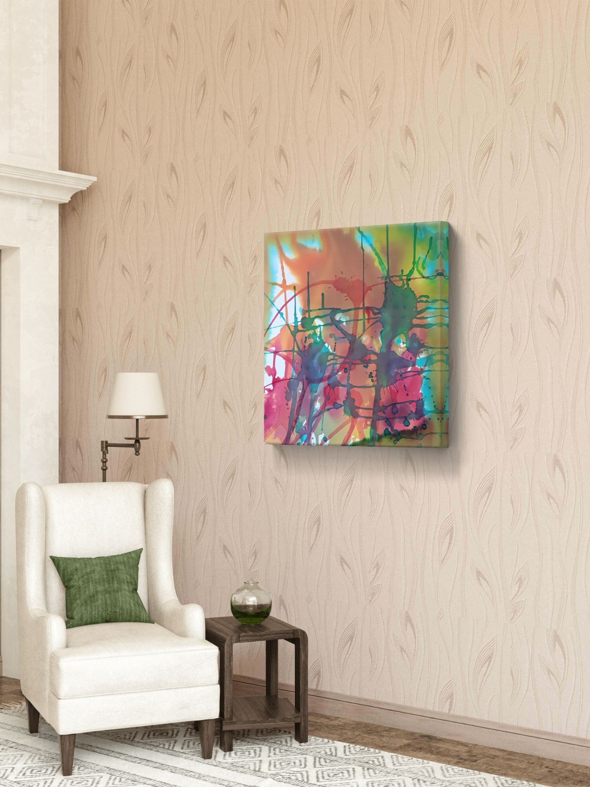 Original abstract painting titled 'The Noise' by TRAXI, featuring fragmented forms and energetic movement. The artwork explores urban life and contemporary chaos through abstract expressionism. A square abstract canvas wall art print with vibrant splashes of green, blue, pink, orange, and yellow, displayed on a beige patterned wallpaper wall in a styled living room setting with a white armchair and a side table.
