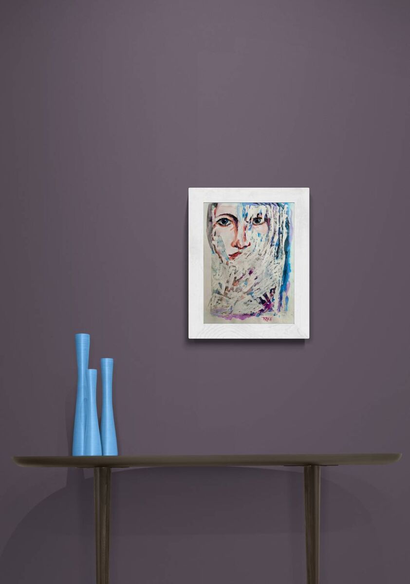 A framed abstract portrait print hangs on a dark purple wall above a console table with three light blue vases. Frozen original emotional watercolor portrait of a woman in blue and white tones by Diana Dimova TRAXI ART.