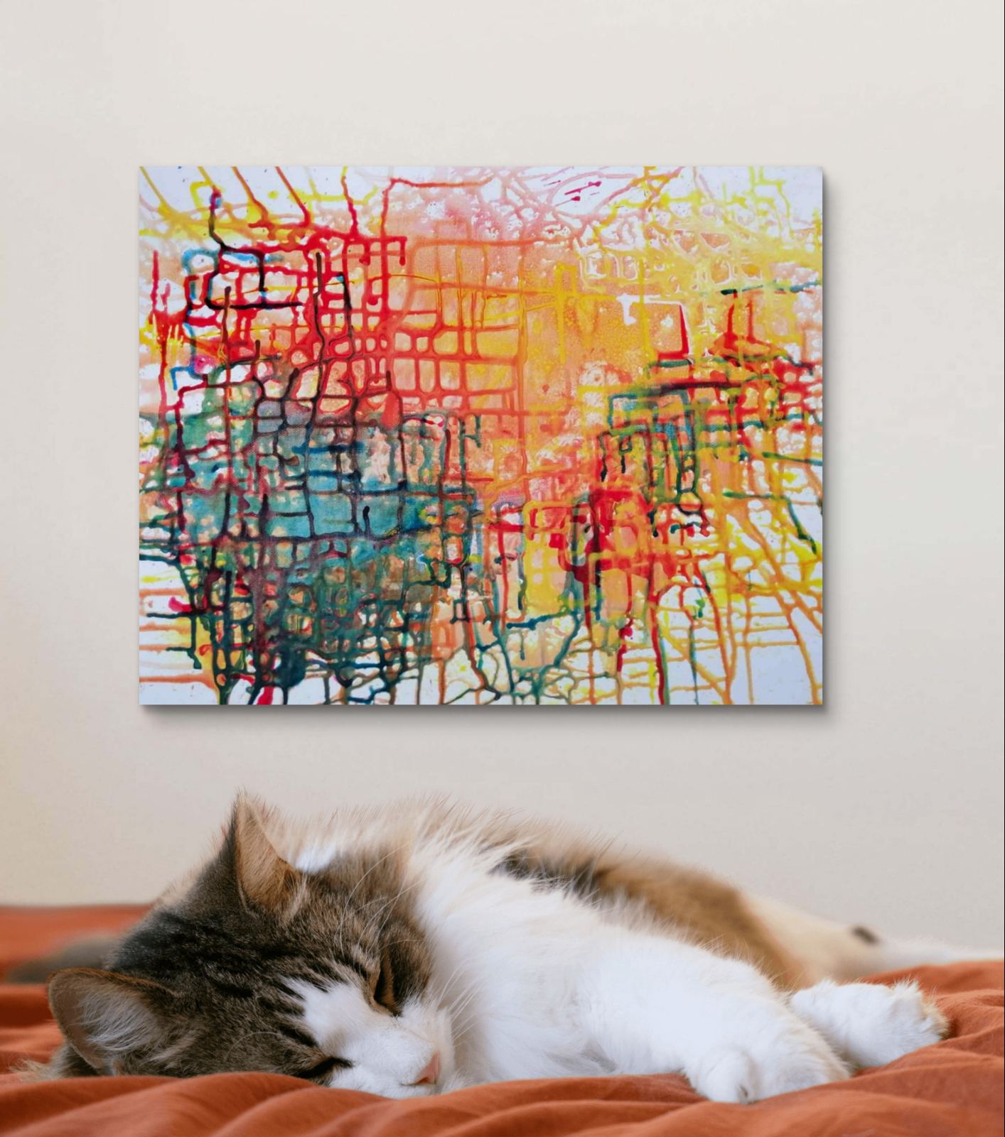 Illusions original checkered abstract painting in red, yellow, green, and orange by Diana Dimova TRAXI ART. Honorable Mention Award winner 2024. A colorful abstract canvas print with red, yellow, blue, green, and orange paint strokes, displayed on a beige wall above a cat sleeping on an orange bed.