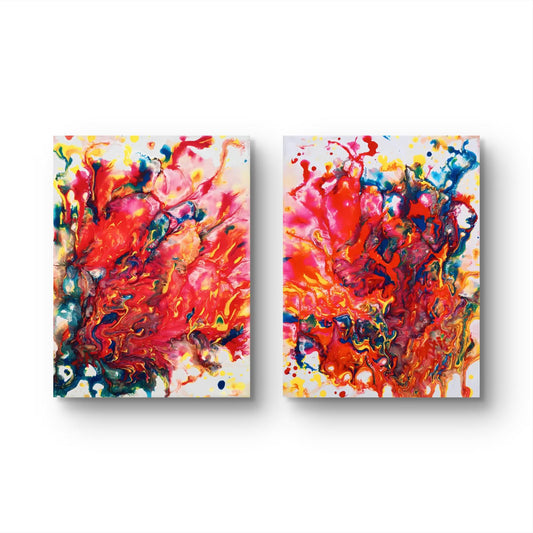 Magic Set large scale limited edition diptych print featuring bold red fluid abstract shapes by Diana Dimova TRAXI ART. Two vertical abstract canvas wall art prints with vibrant red, orange, pink, blue, yellow, and white paint splashes, displayed side by side on a white background.