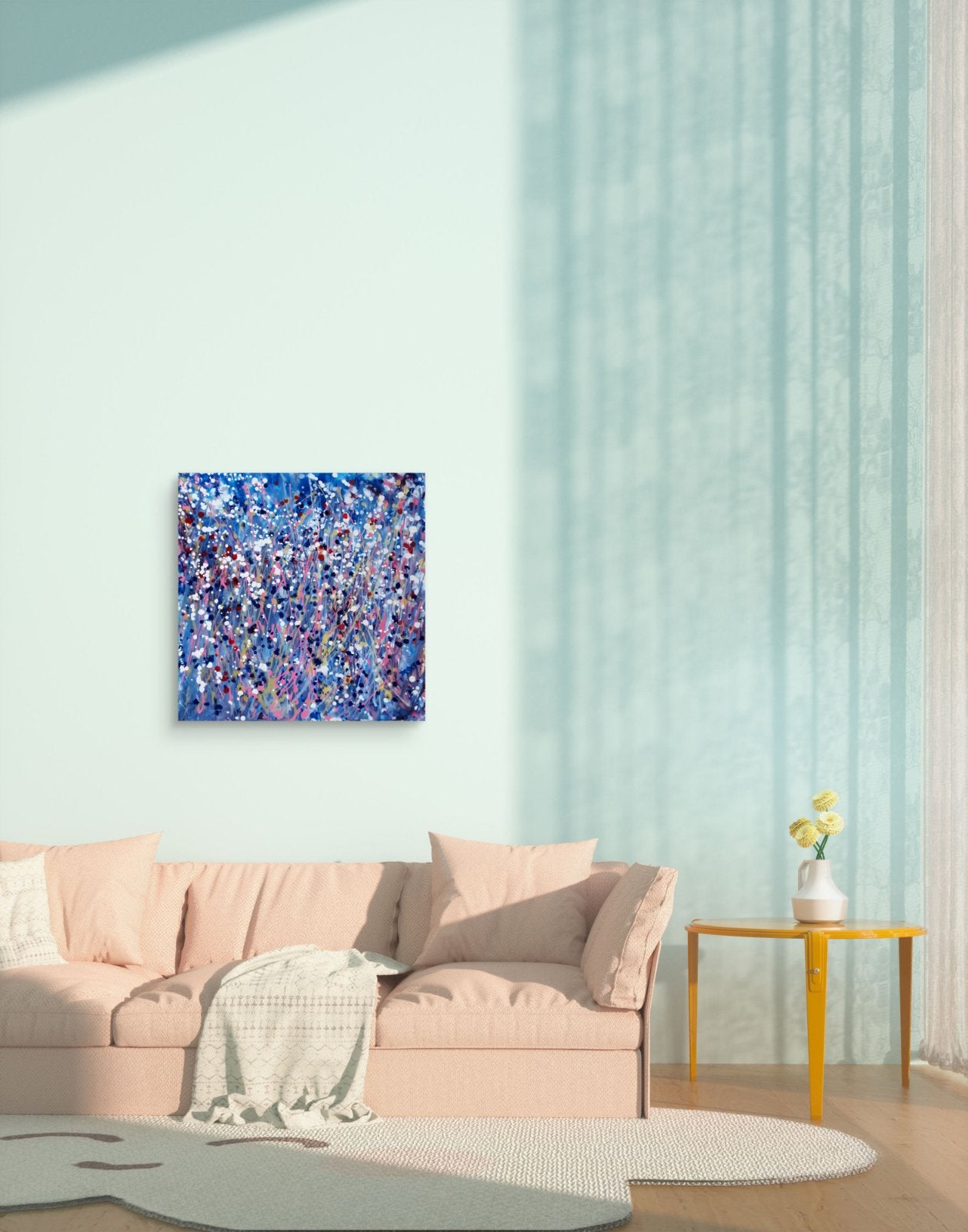 Starlight in the Grass original abstract square painting with calm blue, soft pink, and silver starlight tones by Diana Dimova TRAXI ART. An abstract canvas wall art print featuring a textured, painterly pattern of blue, purple, and white brushstrokes, displayed on a pale mint green wall above a pink sofa in a modern living room setting.
