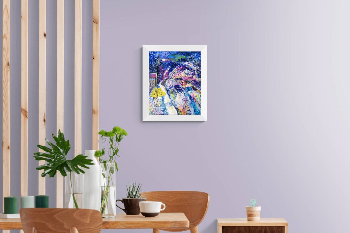 Together We Walk original romantic night city abstract fluid acrylic painting with soft blue, pink, and yellow light tones by Diana Dimova TRAXI ART. A colorful abstract painting of a dog in a white frame, displayed on a light purple wall in a modern room setting with a wooden table, chairs, and plants.