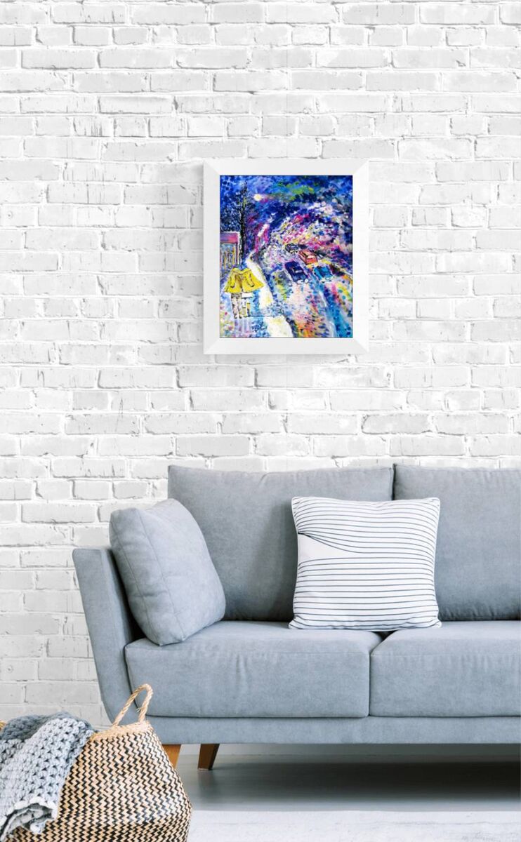 Together We Walk original romantic night city abstract fluid acrylic painting with soft blue, pink, and yellow light tones by Diana Dimova TRAXI ART. A colorful abstract framed wall art print hanging on a white brick wall above a light gray sofa with pillows.