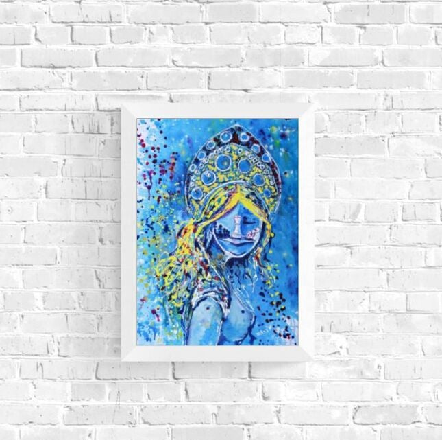 Original spiritual abstract painting titled White Queen’s Move by Diana Dimova TRAXI, featuring a cosmic goddess and chess symbolism in luminous blue and white tones. Framed artwork of a blue-skinned figure with a headdress on a white brick wall.