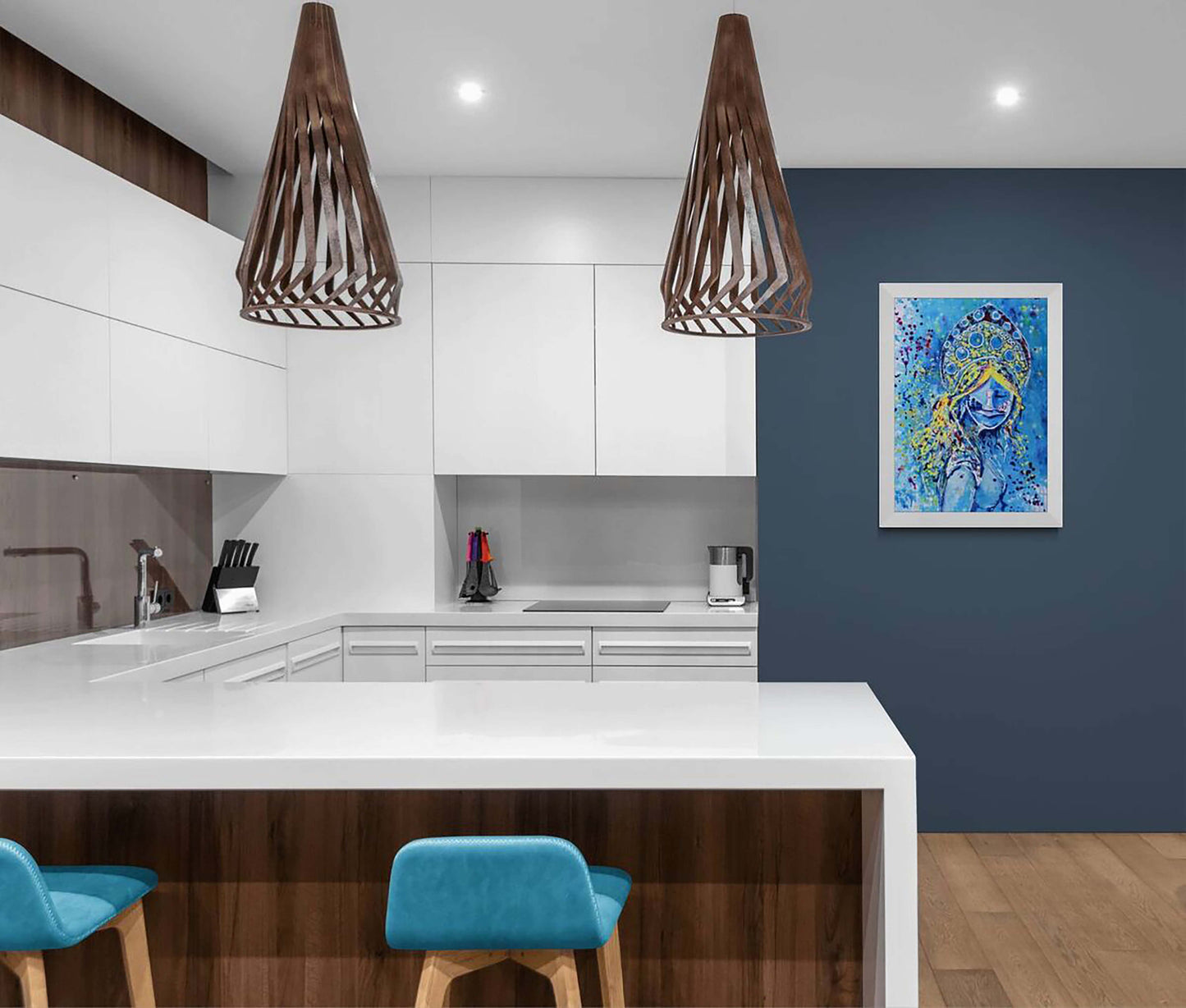 Original spiritual abstract painting titled White Queen’s Move by Diana Dimova TRAXI, featuring a cosmic goddess and chess symbolism in luminous blue and white tones. A modern kitchen interior with white cabinetry, a white island countertop, two brown slatted pendant lights, blue bar stools, and a framed blue abstract artwork on a dark blue wall.