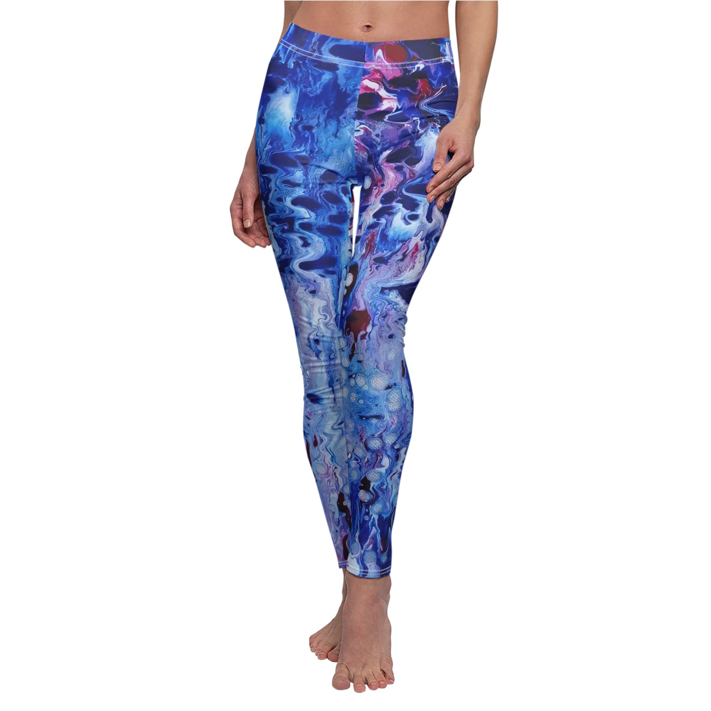 Women's blue ocean leggings of happiness featuring abstract wearable art inspired by underwater paintings by Diana Dimova TRAXI. A person modeling blue abstract-print leggings against a plain white background, cropped from just below the chest to the feet.