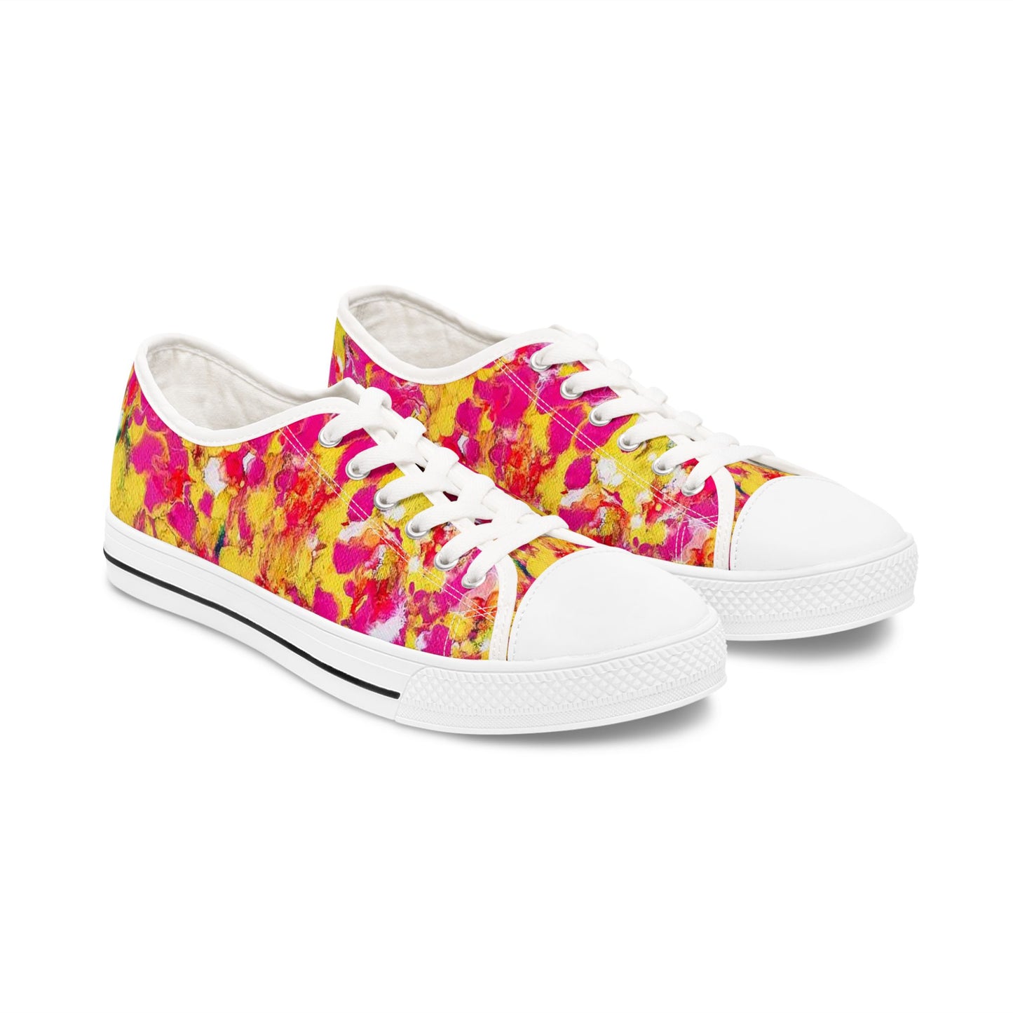 Women's low top sneakers of happiness featuring abstract wearable art inspired by the painting Summer Flowers by Diana Dimova TRAXI. A pair of low-top canvas sneakers with a vibrant abstract floral pattern in hot pink, yellow, and orange, featuring white laces, white rubber toe caps, and white soles.